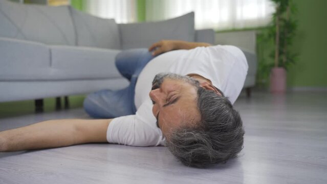 Elderly man having an epileptic attack at home.