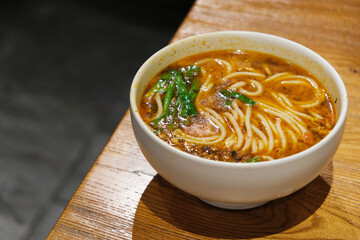 a bowl of Yunnan rice noodle soup on dinner table. Traditional food in Yunnan, China