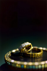 A Couple Of Wedding Rings Sitting On Top Of A Table