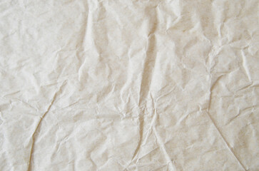 Creative background with scattered overlay of crumpled papers.	
