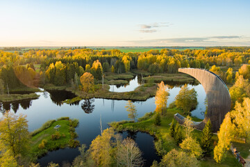 Amazing aerial view of Kirkilai karst lakes and lookout tower in the bright sunny autumn morning, Birzai eldership, Lithuania