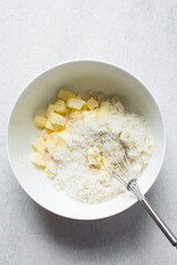 Creaming butter and sugar with a whisk, the process of making a cake, mixing butter and sugar to make a cake