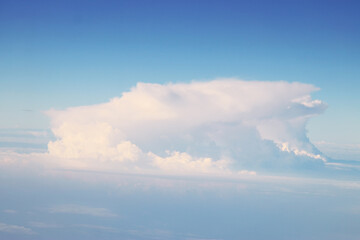 image of clouds in the blue sky taken from the plane