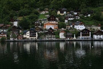 Fototapeta na wymiar Mountain-Enveloped Lakeside Hamlet in Austria