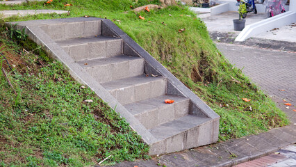 Stone steps going up into a fresh green garden. Stone steps leading up. Curved Stone paved stairs...