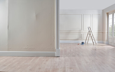 Man home renovation, paint whitewash, repairing and wall concept, home interior style.