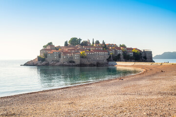 Panoramic view from the coast of the famous tourist location Sveti Stefan island near the city of Budva, Montenegro