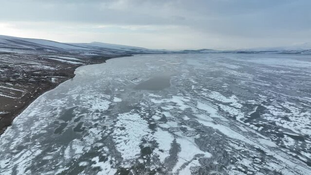 Aerial view of frozen Lake Paravani. The largest lake in Georgia at an altitude of more than 2000 meters.