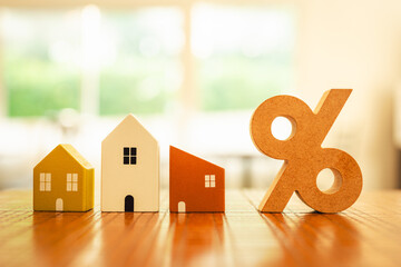 Percentage and house sign symbol icon wooden on wood table. Concepts of home interest, real estate, investing in inflationม home loan interest rate hike.	
 - obrazy, fototapety, plakaty