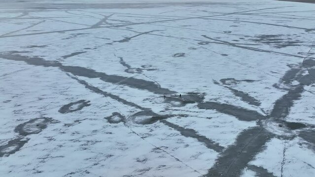 Aerial view of frozen Lake Paravani. The largest lake in Georgia at an altitude of more than 2000 meters.
