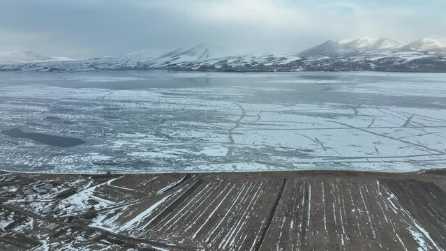 Aerial view of frozen Lake Paravani. The largest lake in Georgia at an altitude of more than 2000 meters.