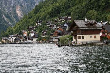 A lakeside town with colorful buildings and boats on the water, Austria