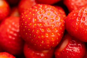 Wild strawberries in a pile. Juicy strawberries picked by hand