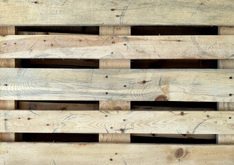 Used wooden pallet closeup texture with circle prints of goods, abstract riugh background
