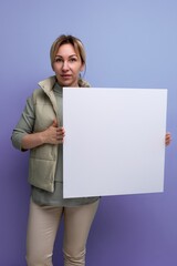 young blond hair woman demonstrating notice board with blank space