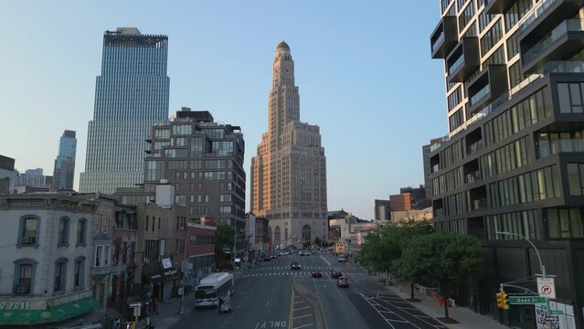rising over Fourth Ave. in Brooklyn facing One Hanson Place building