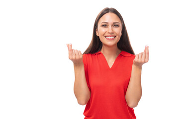 young cute kind european woman with black hair is dressed in a red t-shirt on a white background