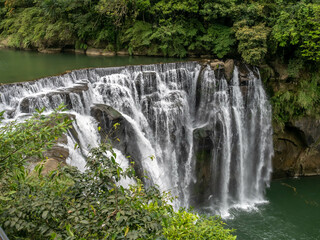 Fototapeta na wymiar Shifen waterfall, landmark natural viewpoint near Taipei, Taiwan, in summer season.