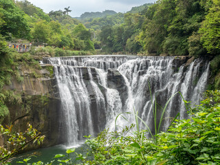 Fototapeta na wymiar Shifen waterfall, landmark natural viewpoint near Taipei, Taiwan, in summer season.