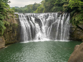 Shifen waterfall, landmark natural viewpoint near Taipei, Taiwan, in summer season.