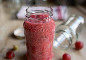 Gooseberry compote in a glass jar 