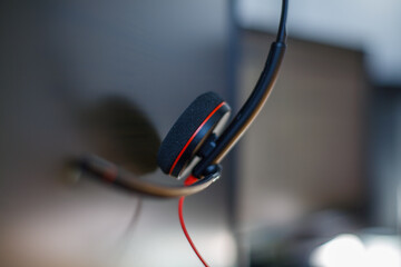 The headset of a customer support employee, left behind after artificial intelligence takes over his job 