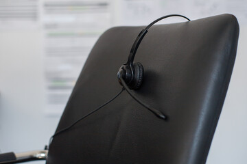 The headset of a customer support employee, left behind after artificial intelligence takes over his job 