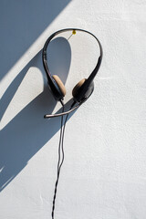 The headset of a customer support employee, left behind after artificial intelligence takes over his job 