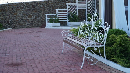 Vintage bench. Forged Products. Metal chair in the park. Butterfly style.