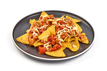 Plate of corn chips nachos with fried minced meat and cheese, isolated on white background.