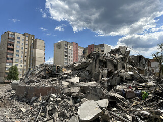 An apartment building damaged by the war. Destroyed multi-storey building from the explosion of an enemy rocket. The ruins of a blown up residential building in Ukraine.