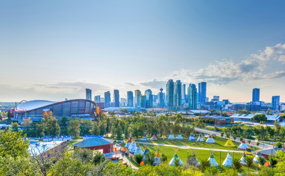 Calgary, Alberta, Canada. July 5, 2023. Downtown Calgary sky view during stampede festival with the Indian Village also call Indigenous space or Elbow River Camp.