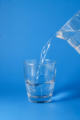 Pour water into a clear glass.