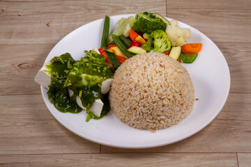 Cilantro Paneer With Grilled Veggies in white plate on wooden background