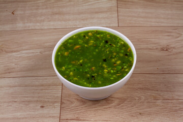 Mushroom And Broccoli Soup in white bowl on wooden background