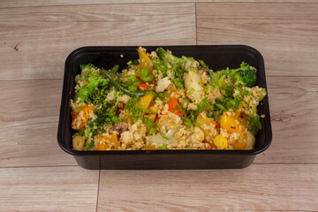 7 Color Vegetable With Couscous in black container on wooden background