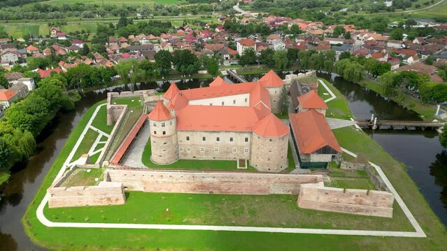 Cinematic aerial perspective of Fagaras City. Drone forward passing above Făgăraș Citadel.  Beautiful panoramic view of all city of Fagaras. The fortress was a prison for political detainees.
