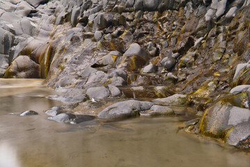 eroded lava rock and river in Alcantara Gorge in Fondaco Motta, near Catania ,Sicily, Italy