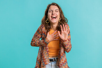 Amused lovely woman pointing finger to camera, laughing out loud, taunting making fun of ridiculous appearance, funny joke anecdote. Pretty brunette girl isolated alone on blue studio background - obrazy, fototapety, plakaty