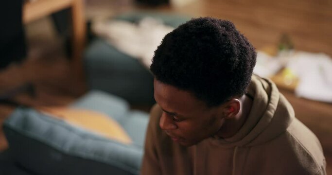 Portrait of happy smiley delighted African American multinational man guy student wearing casual outfit smiling with beautiful white teeth sitting in cozy living room preparing for lessons.