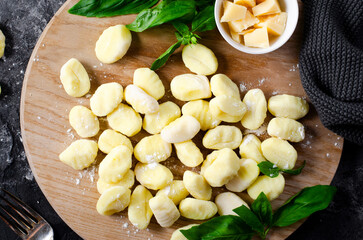 Gnocchi, Fresh Uncooked Potato Gnocchi on Wooden Board, Italian Cuisine