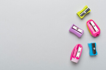 Different sharpeners on color backgroung, top view