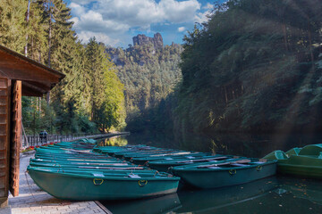 boats at the jetty in the elbe sandstone mountains