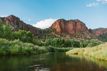 Blue sky behind Colorado Cliffs overlooking the lake