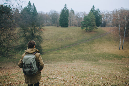 Man hiking in forest with backpack