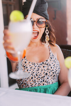 woman cheersing at restaurant 
