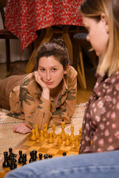 Two girl playing chess  