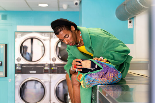 Fashionable queer man in laundry