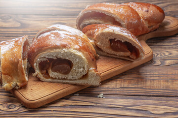burgers with blackcurrant jam on wooden background