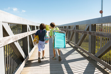 Two brothers walking to the beach